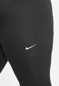 Nike Performance PLUS - Leggings - dk smoke grey/black/white