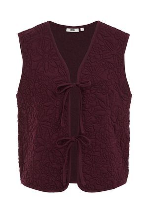 Burgundia ilma varrukatega vest, millel on lilleline tikandimuster, V-kaelus ja ees kinnitusnöör. Pehme, tekstureeritud kangas ümarate äärtega.