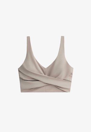 Beige crop top with wide shoulder straps and a twisted fabric design across the front.
