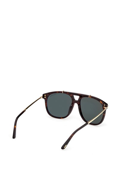 Braune Schildpatt-Sonnenbrille mit grauen Gläsern und goldenen Metallelementen. Das Gestell ist eckig mit einem markanten Brückendesign und bietet einen retro Look.