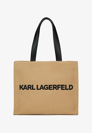 Téglalap alakú bézs színű szőtt táska fekete "KARL LAGERFELD" felirattal és két hosszú fekete bőr fogantyúval.