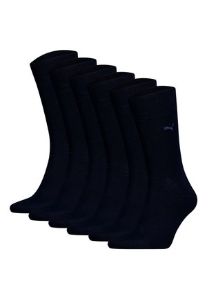 Svarta bomullssockor med ett ribbat mönster och logodetalj, samlade i ett paket med sex par, med en mjuk textur och medelhöjd vid vaden.