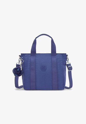 Borsa a spalla viola in nylon, con due manici superiori e una tracolla rimovibile. Presenta un caratteristico charm a pompon attaccato.