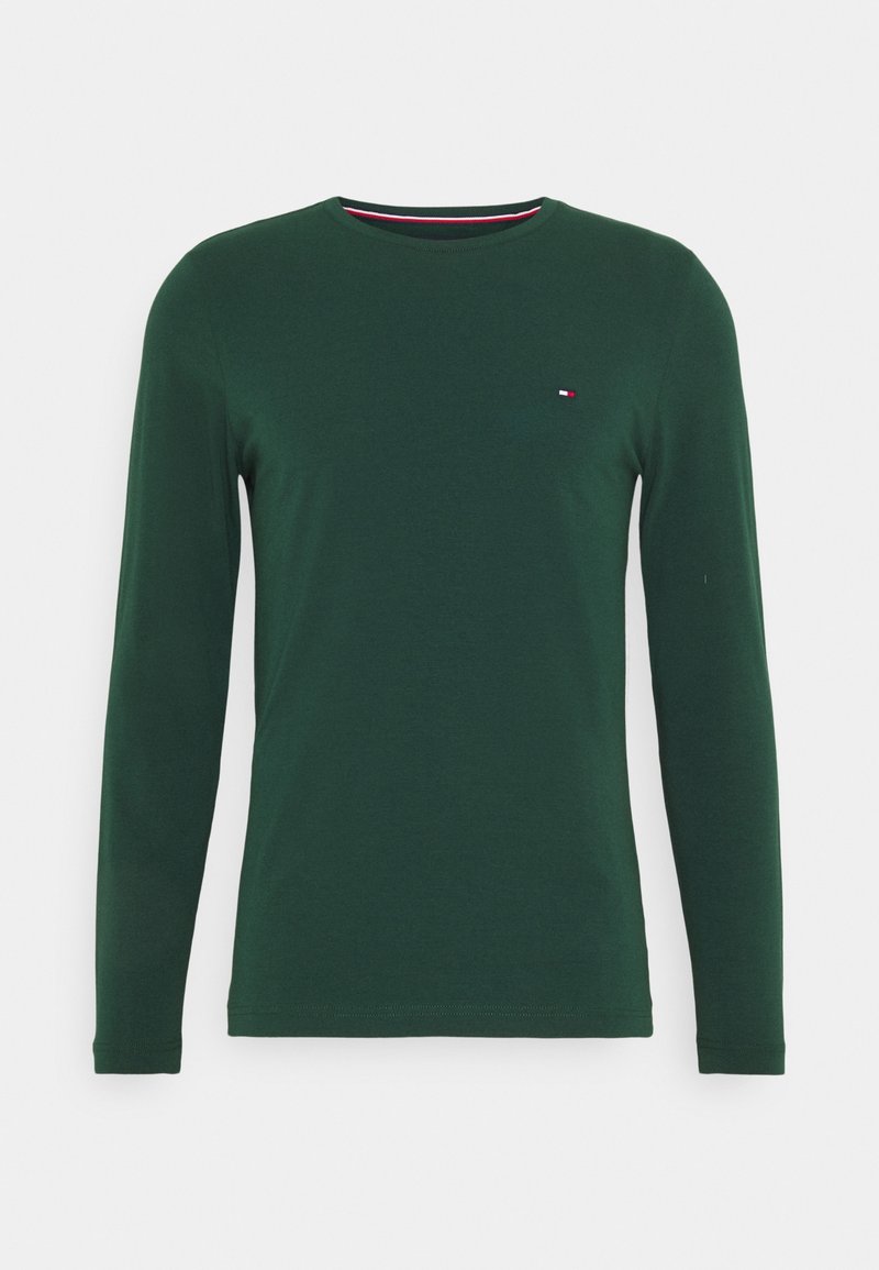 Long-sleeve green t-shirt made of soft cotton, featuring a round neck and a small logo in red, white, and blue on the chest.