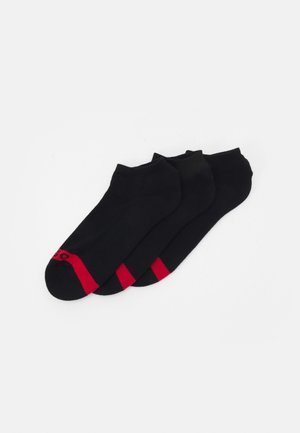 Black ankle socks, three pairs, featuring red accents on the toe. Made of smooth, stretchy fabric with a snug fit.