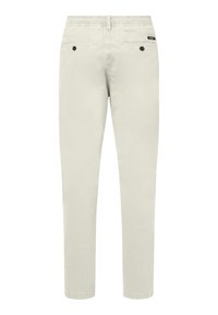 Pantalon décontracté beige avec taille élastique, deux poches arrière à boutons et une petite étiquette de marque noire sur la poche droite.