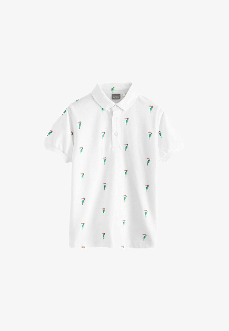 Polo shirt blanc en coton, avec un motif répétitif de petits dessins verts et roses, patte de boutonnage et manches courtes.