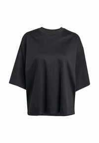 Sort t-shirt lavet af blød bomuld, med rund halsudskæring, korte ærmer og en afslappet pasform, med en flad kant og uden synlige logoer.