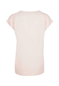 Lys rosa t-skjorte med korte ermer laget av myk stoff, med rund hals og rullede ermer. Enkel, ensfarget bakdesign.