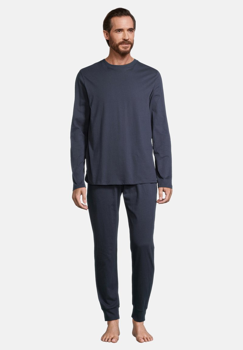 Haut à manches longues bleu marine et pantalon assorti en tissu doux. Le haut présente un col rond ; le pantalon a des jambes fuselées avec des ourlets.