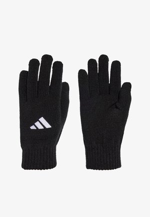 Czarne, dziergane rękawice z prążkowanymi mankietami, na jednej z nich znajduje się białe logo adidas z trzema paskami na grzbiecie ręki skierowanym do góry.