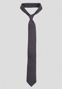 Granatowy krawat z białymi wzorami kwiatowymi, wykonany z gładkiego materiału. Smukły kształt z ostrym końcem, z tradycyjnym węzłem czterech w rękach.