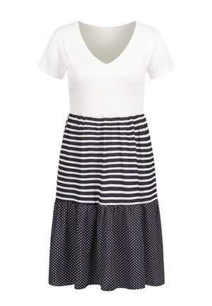 Balta V veida kakla topa, tumši zils svītrots vidusdaļa un svārki ar punktiņu rakstu. Īsas piedurknes, savākta jostasvieta un plūstošs, daudzpakāpju dizains.