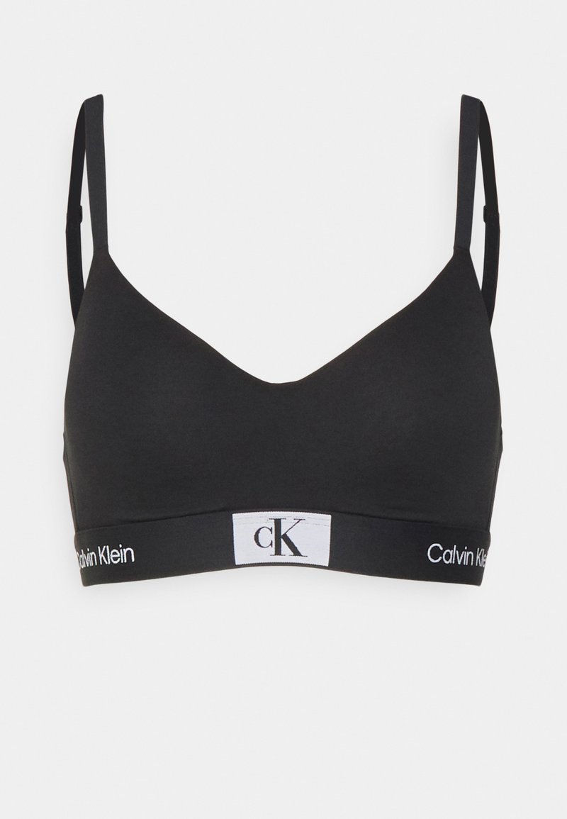 Sosten negro inalámbrico hecho de una tela suave; cuenta con tirantes ajustables y una banda elástica con logotipos en blanco.