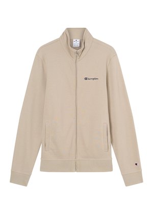 Beige Trainingsjacke mit Reißverschluss aus glattem Stoff, mit hohem Kragen, zwei Seitentaschen und dem Champion-Logo in Marineblau gestickt.