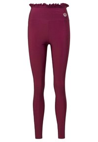 Bordeaux leggings med volang midja, tillverkade av slätt tyg, med en liten vit logo på höften. Formanpassad design.