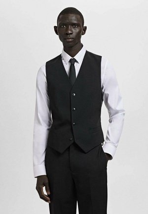 Black vest over a white shirt, featuring a smooth texture, five buttons, and two front pockets. Accompanied by a black tie.