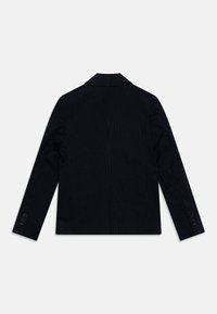 Czarna marynarka w prążki z klapą w kształcie notcha, pojedynczym wentylkiem z tyłu i mankietami z guzikami. Wykonana z teksturowanej tkaniny, posiada dopasowany krój.