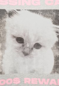 Close-up of a distressed white cat with dark eyes, framed by pink text on a gray background.