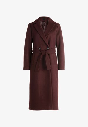 Long burgundy wool coat with wide lapels, double button closure, and matching fabric belt tied at the waist.