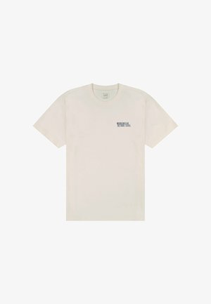 Kremowy bawełniany t-shirt z krótkimi rękawami i okrągłym dekoltem. Na piersi znajduje się granatowy napis "WORKWEAR IS FOR SOUL".