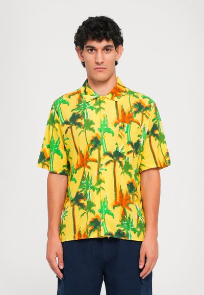 Short-sleeved collared shirt with a yellow background, featuring a palm tree pattern in green and orange. Material appears lightweight.