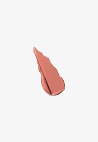 Smudge of creamy, matte nude-pink lipstick color on a white background.
