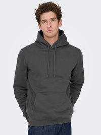 Gray hooded sweatshirt made of cotton blend. Features a kangaroo pocket, adjustable drawstrings, and ribbed cuffs. Smooth texture.
