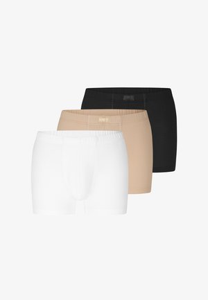 Tre par herreboxershorts i sort, beige og hvid, arrangeret i et forskudt overlappende layout på en hvid baggrund.