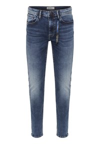 Mörkblå denimjeans med tapered skärning, lätt blekning, femfickorsdesign, kontrasterande sömmar och en tagg fäst vid midjan.