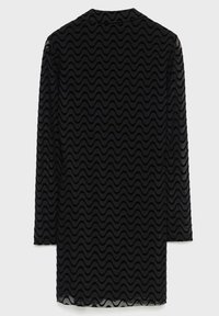 Mini-robe noire à manches longues en tissu transparent avec un motif ondulé en velours sur toute la surface, vue de dos.