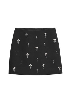 Mini gonna nera con motivi floreali ricamati abbelliti con dettagli in argento. Tessuto liscio con una silhouette aderente e vita elastica.