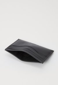 Black leather wallet with a smooth finish, featuring multiple card slots and stitching details, presented in an angled, open position.