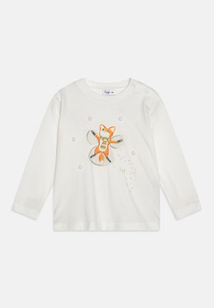 Camisa blanca de mangas largas con un zorro naranja impreso que lleva una bufanda, rodeado de puntos decorativos. Tejido de algodón suave con cierre a presión.