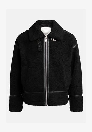 Black fleece jacket with a zip closure, wide collar, and leather accents at the waist and cuffs. Features a textured finish.