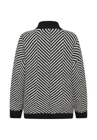 Pull rayé noir et blanc avec motif en zigzag, col haut côtelé, manches longues et poignets noirs sur un fond uni.