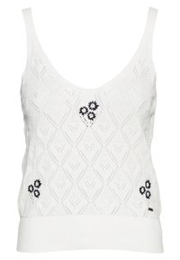 Vitt stickat linne med ett strukturerat diamantsmönster, accentuerat med marinblå blommönsterbroderi och en solid ribbad nederkant.