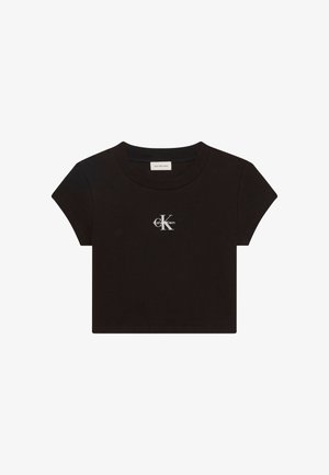 Mustast puuvillast lühendatud t-särk, millel on lühikesed varrukad ja ümar kaelus. Ees on märkimisväärne valge Calvin Kleini logo.