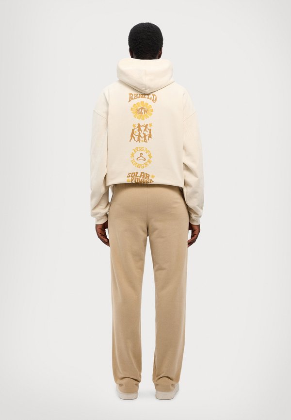 RELAXED SWEATPANTS - Tracksuit bottoms - sand4