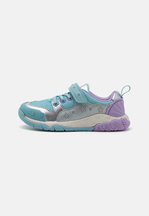 Aqua and silver sneaker with floral patterns, velcro strap, and purple accents. Textured sole with wave design, ideal for active use.