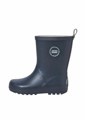 Botte de pluie en caoutchouc marine avec un logo rond, un col texturé gris et un talon renforcé. Dotée d'une semelle plate avec un profil antidérapant.