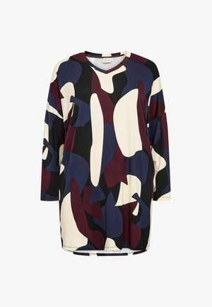 Abstract-gepatroneerde lange mouw top in crème, marineblauw, bordeaux en zwart. Zacht materiaal, relaxte pasvorm en een V-hals met verlaagde schouders.