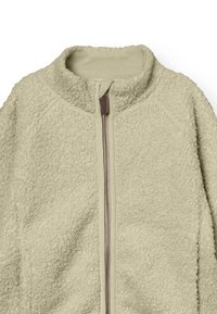 Fleece jas in licht beige met een gestructureerd oppervlak, volledige rits en hoge kraag. Voorzien van raglanmouwen en een rits met aardetint.