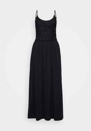 Vestido maxi preto com corpete de renda, alças finas e saia franzida. O tecido é suave, com um design fluido e comprimento total.