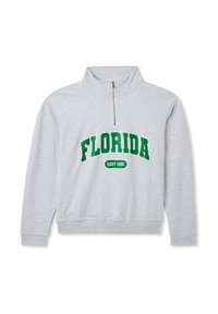 Felpa grigia con collo alto e zip. Presenta il testo verde "FLORIDA" e "EAST 1990". Tessuto morbido con vestibilità rilassata.