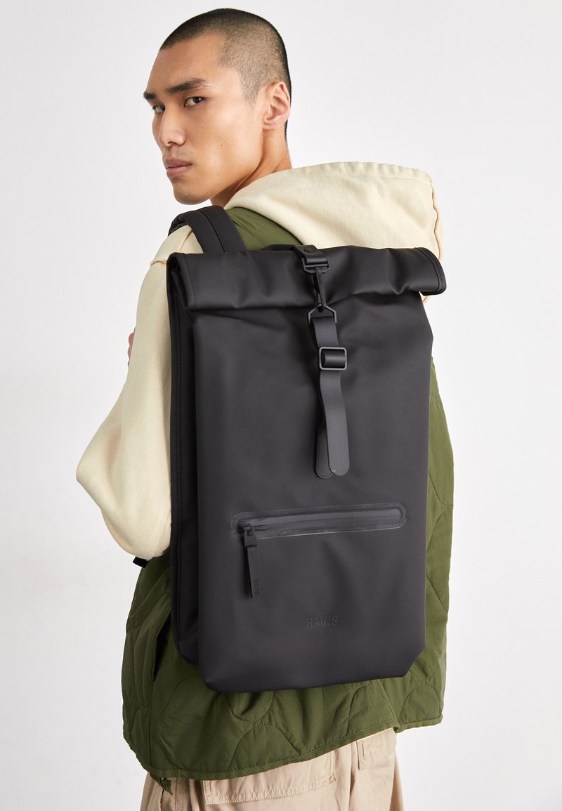 rolltop rains backpack Sibu Rucksack Mini complemented by a front compartment with a coated zipper and multiple side pockets Rains Sibu Rolltop Rucksack Mini