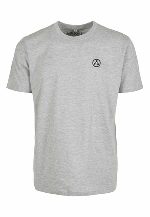 Hallikrae millisärg, lühikeste varrukatega, millel on väike must ringikujuline logo vasakul rinnal. Klassikaline ümmargune kaelus.