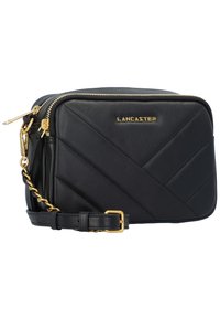 Borsa a tracolla in pelle nera con design trapuntato, dettagli in oro e tracolla a catena rimovibile. Presenta una chiusura con zip e un logo distintivo.