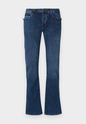 Denim flared jeans i dyb blå, med forlommer, lynlås i gylpen og diskrete stikninger på taljebåndet og kanten.