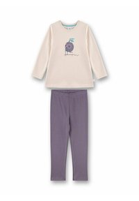 Maglia a maniche lunghe color crema con grafica di un personaggio dei cartoni animati, abbinata a leggings viola. Entrambi gli articoli sono in morbido cotone.
